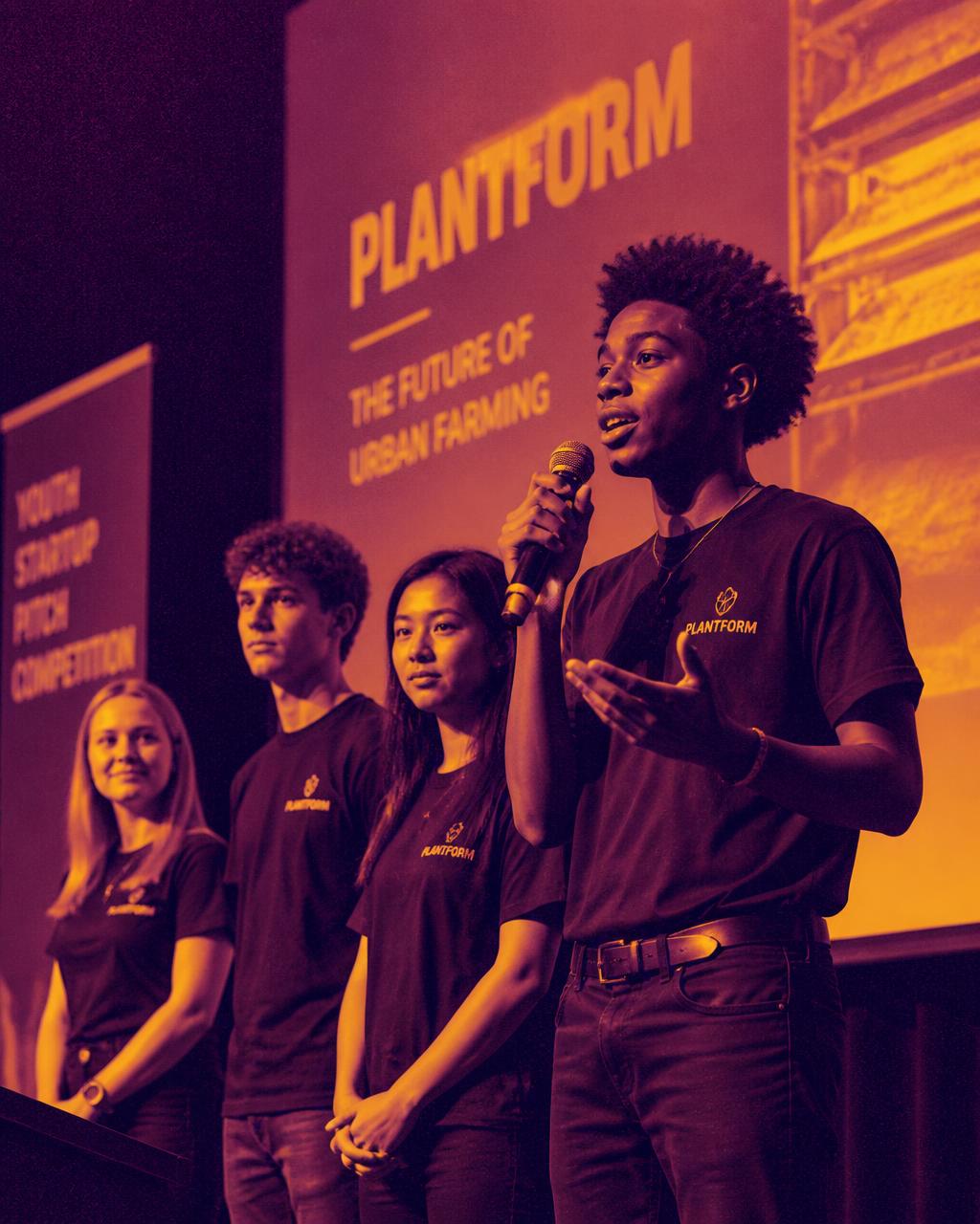 A high school founder pitching an idea to a judging panel